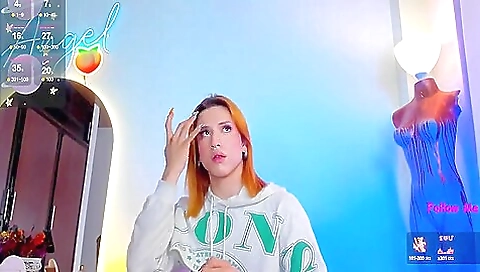 Sexy redhead with a small tattooed pussy plays with her pussy